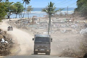 A truck weaves its way through Lalomanu, after last year's tsunami. Photo / Greg Bowker