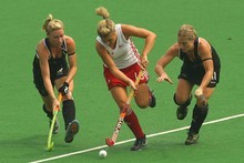 England's Georgie Twigg is shadowed by Black Sticks players Anita Punt (left) and Stacey Carr last night. Photo / Getty Images England's Georgie Twigg is shadowed by Black Sticks players Anita Punt (left) and Stacey Carr last night. Photo / Getty Images
