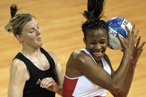 Pamela Cookey of England receives a pass in front of Casey Williams of New Zealand. Photo / Getty Images