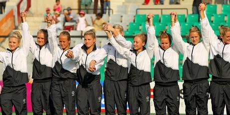 Members of the New Zealand hockey team celebrate on the podium before receiving their silver medals. Photo / Getty Images Members of the New Zealand hockey team celebrate on the podium before receiving their silver medals. Photo / Getty Images