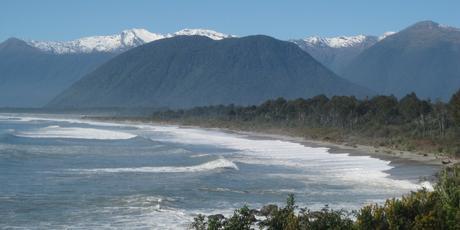 The sweep of Jackson Bay looking north towards Haast with the Southern Alps in the background. Photo / Jill Worrall The sweep of Jackson Bay looking north towards Haast with the Southern Alps in the background. Photo / Jill Worrall