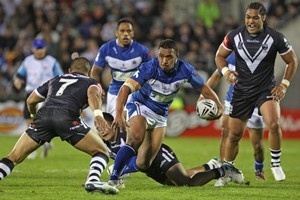 Masada Iosefa of Toa Samoa looks to evade the Kiwis defence. Photo / Getty Images