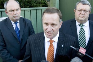 John Key flanked by Transport Minister Steven Joyce and Economic Development Minister Gerry Brownlee after yesterday's meeting with Warner Bros. Photo / Mark Mitchell