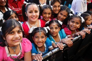 Young girls in performance costumes gather near the stage for Diwali in Auckland. Photo / Sarah Ivey
