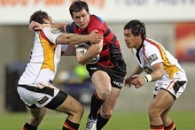 Ryan Crotty of Canterbury is tackled by Trent Renata of Waikato. Photo / Getty Images Ryan Crotty of Canterbury is tackled by Trent Renata of Waikato. Photo / Getty Images