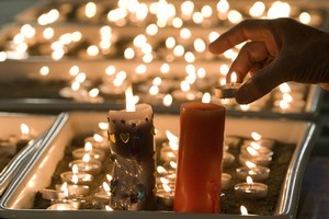 Candles burning at the Holy Trinity Anglican Church in Greymouth. Photo / Mark Mitchell