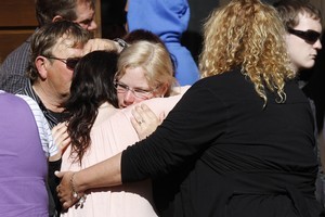 Relatives of the trapped miners leave this morning's briefing. Photo / Mark Mitchell