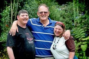 Cliff Robinson with his two intellectually disabled children, Johnny and Marita, at their home in the Coromandel hills. Photo / Natalie Slade