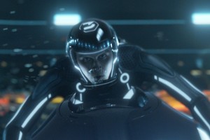 Sam, the son of original Tron hero Kevin Flynn, is called upon the enter of local light cycle derby. Photo / Supplied