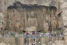 Visitors inspect giant Buddhist statues. Photo / Natalie Gauld Visitors inspect giant Buddhist statues. Photo / Natalie Gauld