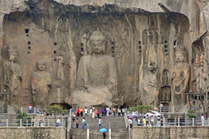 Visitors inspect giant Buddhist statues. Photo / Natalie Gauld