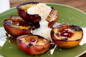 Caramelised nectarines with coconut cream. Photo / Babiche Martens