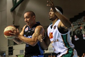 Rosell Ellis of the Crocs holds his defence against Paul Henare of the Breakers. Photo / Getty Images