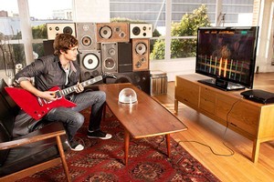Rocksmith, for Xbox and PlayStation, uses real guitars, unlike the very popular Guitar Hero series.
