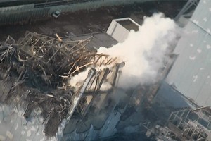 Thick white smoke billows from the number 3 unit of the Fukushima Dai-ichi nuclear power plan. Photo / AP
