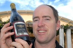 Martinborough Vineyard winemaker Paul Mason with a bottle of their 1998 Reserve pinot noir. Photo / Lynda Feringa