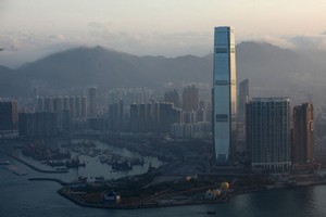 The International Commerce Centre (ICC) towers above other Hong Kong skyscrapers. Occupying the ICC's 102nd to 118st floors, the world's highest hotel - the Ritz-Carlton - has recently opened its doors. Photo / AFP