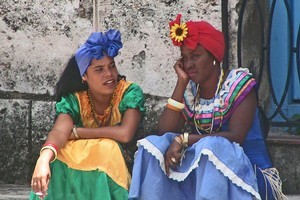 Women dressed in traditional outfits in the vibrant Cuban capital of Havana. Photo / Esther Sinke