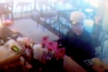 A thief steals a collection pot belonging to the Japanese society at Saika Japanese restaurant. Photo / Supplied A thief steals a collection pot belonging to the Japanese society at Saika Japanese restaurant. Photo / Supplied
