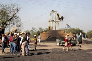 People wait outside a coal mine in San Juan de Sabinas, in the Mexican state of Coahuila after a gas explosion in the mine killed at least three miners. Photo / AP