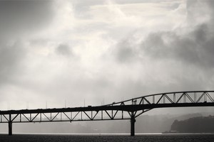 Storm clouds over the Auckland Harbour Bridge. Photo / Greg Bowker