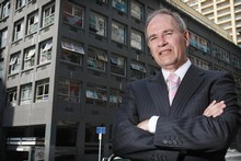 Len Brown outside the graffiti-covered Yates building on Albert St. Photo / Greg Bowker 