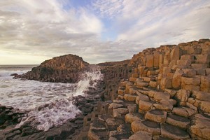The Giant's Causeway in County Antrim - the result of an ancient volcanic eruption - sets a magical tone for its wild and wind-lashed coast. Photo / britainonview/Martin Brent