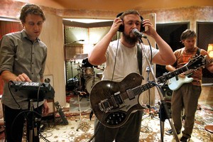 Engineer Simon Gooding (left), with Ben King and Milan Nobilo of Grand Rapids prepare for their showcase at York Street Studios. Photo / Natalie Slade