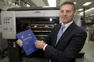 Finance Minister Bill English with a copy of the Budget he will present tomorrow. Photo / Mark Mitchell