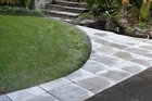 Straight lines are all important when putting in the pavers. Photo / Steven McNicholl