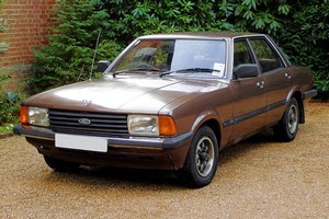 Many great Fords have worn the Ghia badge, including the mighty Cortina, pictured here resplendent in back fence brown. Photo / Wikimedia Commons