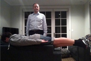 John Key's son, Max, makes his 'PM plank' while his father stands behind him, creating what one Facebook user dubbed a 'National plank'. Photo / Supplied