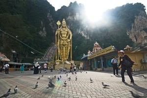 Batu Caves, once a rich source of limestone for English settlers building roads, is now a busy tourist attraction, just north of Kuala Lumpur. Photo / Tourism Malaysia