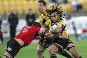 Ma'a Nonu of the Hurricanes is tackled by George Whitelock of the Crusaders. Photo / Getty Images