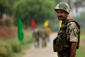 Indian Border Security Force soldier keeps alert at the India Pakistan border. Photo / AP