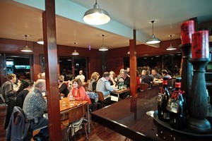 Titirangi's The Refreshment Room shows up in a blaze of light. Photo / Chris Loufte