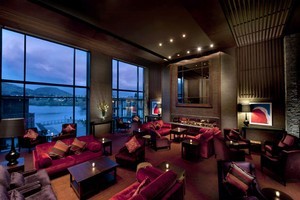 The lobby lounge at Hilton Queenstown affords views across Lake Wakatipu. Photo / Supplied