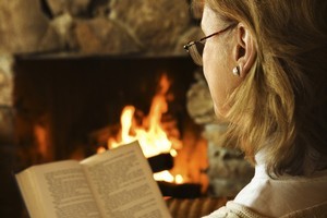 Ignore the balmy weather by snuggling up indoors with a good book at hand. Photo / Thinkstock