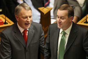 Voters may like Phil Goff's policies, but John Key (right) trounces in the preferred Prime Minister stakes. Photos / File