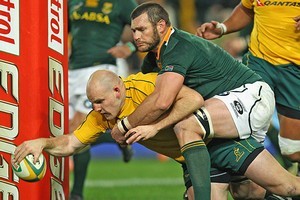 Danie Roussow of the Springboks can't stop Stephen Moore of Australia from coring a try. Photo / Getty Images
