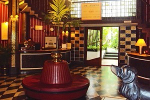 The foyer of the Atlanta Hotel retains its 1950s style with chandeliers, old telephones, a writing room and library and bronze dachshunds. Photo / Shandelle Battersby