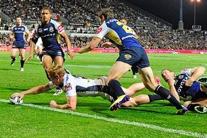 Jack Reed of the Broncos scores the second try of the match. Photo / Getty Images