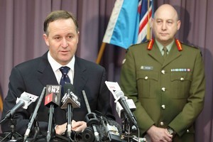 Prime Minister John Key addresses a media conference at the RNZAF Base in Whenuapai this morning, following the death of an NZSAS trooper in Afghanistan yesterday. Photo / Greg Bowker