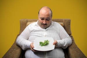 While women are more likely to put on weight after getting hitched, men tend to pack on the pounds when they are ditched. File photo / Thinkstock