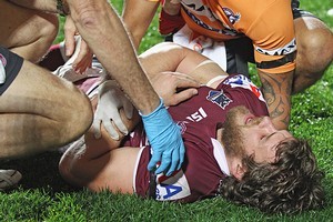 David Williams of the Sea Eagles receives attention from the trainers. Photo / Getty Images
