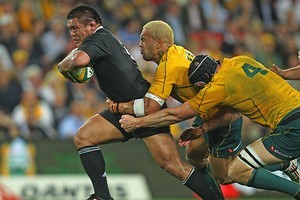 Keven Mealamu of the All Blacks is tackled by Digby Ioane and Dan Vickerman of the Wallabies. Photo / Getty Images