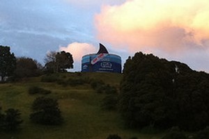 An Auckland reservoir has been turned into a giant tuna can in a campaign by Greenpeace, which claims New Zealand seafood company Sealord buys tuna caught using destructive fishing methods. Photo / supplied