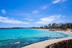 Cala Millor's promenade is lined with benches where Spaniards regularly meet of an afternoon to sit and watch the surf. Photo / Thinkstock
