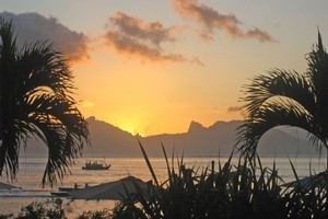 The spectacular view at sunset from the Papeete seafront, home to Les Roulottes. Photo / Sophie Bond