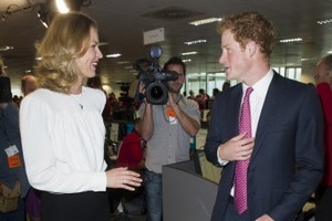 Czech model Eva Herzigova with Prince Harry on the trading floor as he attends BGC Partners' Charity Day in London.